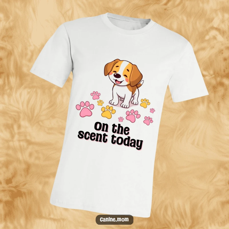 Funny Beagle t-shirt showing a smiling dog happily sniffing a trail of giant, colorful paw prints, perfect for adventure lovers.