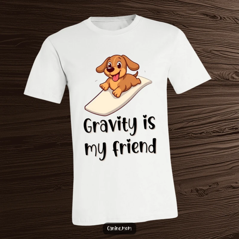 Funny t-shirt with a cheerful dachshund zooming down a slide on its belly, expressing pure playful excitement and a love for speed.
