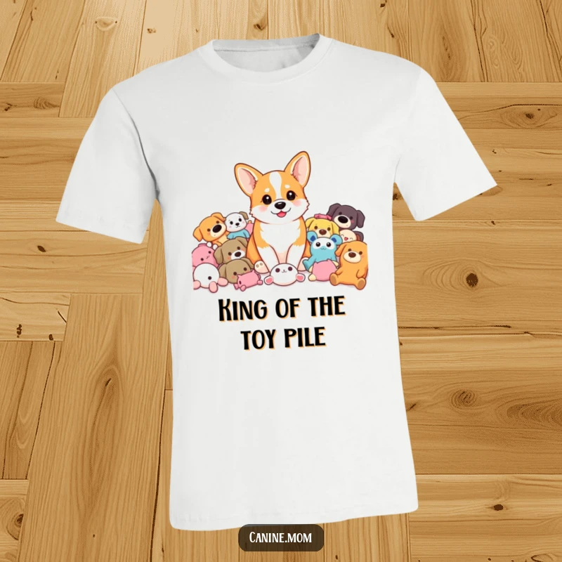 Funny Corgi T-Shirt: A joyful corgi surrounded by a colorful assortment of dog toys, embodying playtime happiness. A great funny gift.