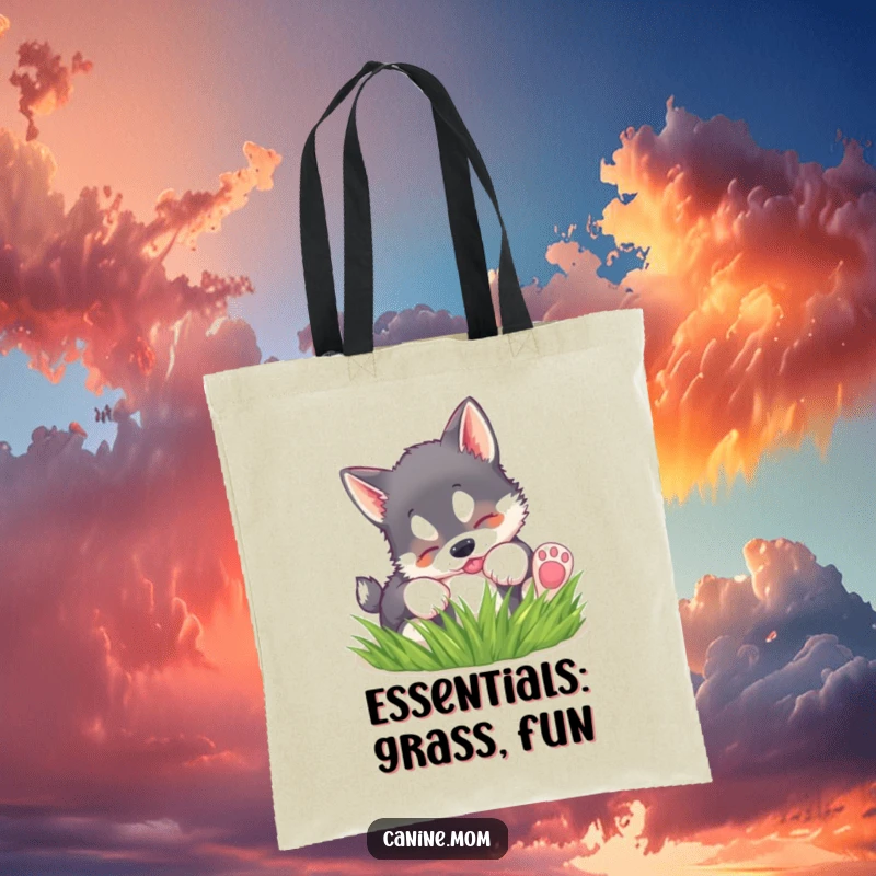 Funny tote bag featuring a husky puppy playfully rolling in green grass, perfect for carrying essentials with charm.