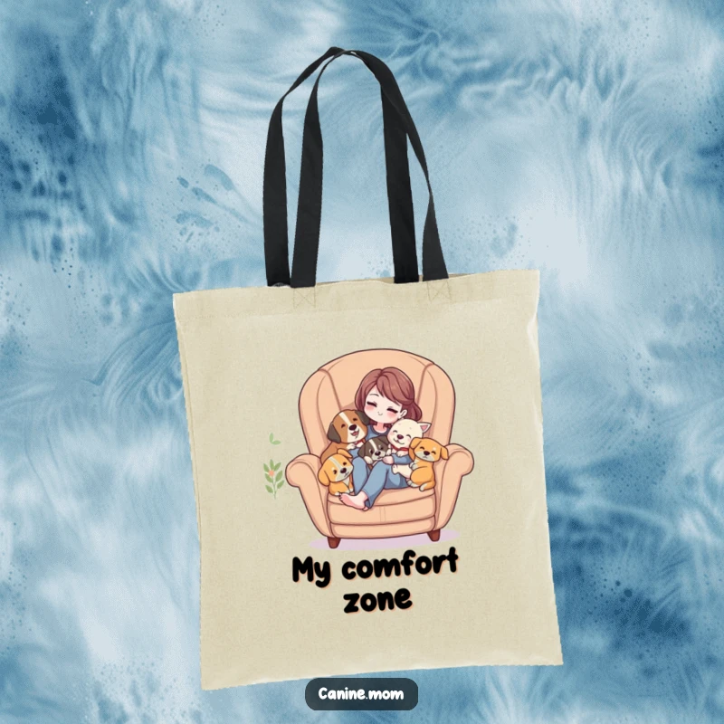 Funny Tote Bag: Woman in a cozy armchair, surrounded by several dogs enjoying affectionate cuddles.